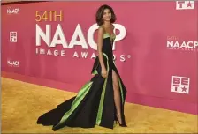  ?? PHOTO BY RICHARD SHOTWELL — INVISION/AP ?? Zendaya in a vintage black and green Atelier Versace gown at the NAACP Image Awards in February.