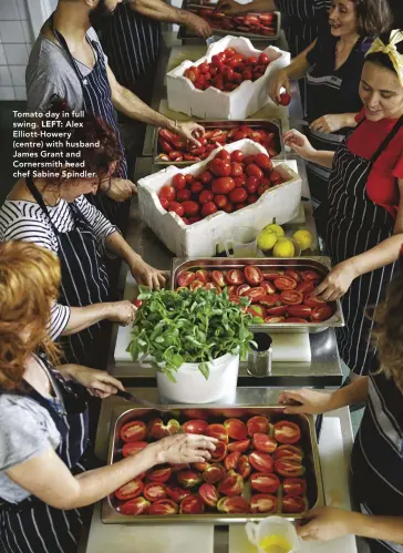  ??  ?? Tomato day in full swing. LEFT: Alex Elliott-Howery (centre) with husband James Grant and Cornersmit­h head chef Sabine Spindler.