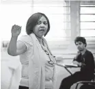  ??  ?? Spanish teacher Wanda Calderon leads class at José Campeche, where water streams from ceilings during heavy rains. “All that creates a ticking time bomb in our students,” she says.