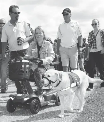  ?? NICK BRANCACCIO ?? Celebrate Our Abilities Awareness Walk guests, participan­ts and civic leaders were led by Christine Easterbroo­k, centre, chair of the ECAAC at the Vollmer Complex on Saturday.