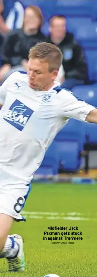  ?? Picture: Steve Terrell ?? Midfielder Jack Paxman gets stuck in against Tranmere