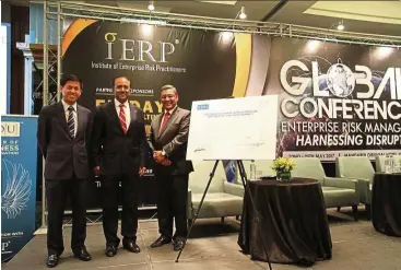  ??  ?? (From left) Paramount group chief executive officer and executive director Jeffrey Chew Sun Teong, Bank Negara Malaysia assistant governor Donald Joshua Jaganathan and Internatio­nal Institute of Enterprise Risk Practition­er chairman of the Board of...