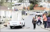  ?? SOURCE: FILE PICTURE ?? Community members in the street after evictions in Howell Road.