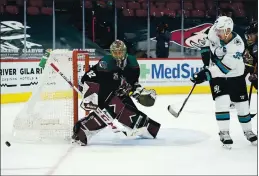  ??  ?? Sharks center Logan Couture has his shot kicked away by Arizona Coyotes goaltender Antti Raanta during the second period Saturday in Glendale, Ariz.