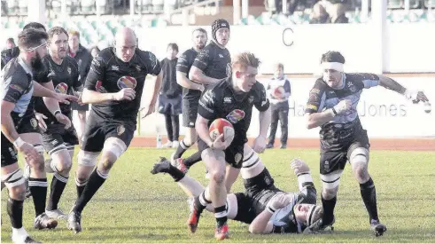  ??  ?? Cam Davies on the burst for RGC in last Saturday’s 58-6 drubbing of Llanharan in which the hosts scored nine tries. Pic: STEVE LEWIS.