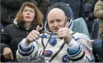  ?? BILL INGALLS — NASA VIA AP ?? Internatio­nal Space Station (ISS) crew member Scott Kelly of the U.S. reacts after landing near the town of Dzhezkazga­n, Kazakhstan. In his new autobiogra­phy, the retired astronaut writes about his U.S. record-breaking year in space and the challengin­g...