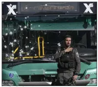  ?? (AP/Mahmoud Illean) ?? Israeli police inspect the scene of an explosion at a bus stop Wednesday in Jerusalem.