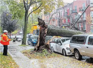  ?? RYAN REMIORZ THE CANADIAN PRESS ?? Some Hydro-Québec customers were without power after rain and strong winds hit the province.