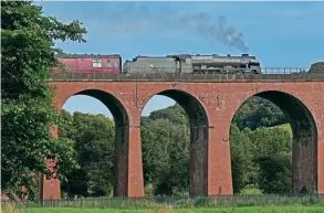  ?? ?? In one of the last charters on Network Rail before the steam ban was bought in as a response to the July heatwave (see News, pages 10 and 11), LMS 4-6-0 No. 46115 Scots Guardsman crosses Whalley Viaduct with the Railway Touring Company’s ‘Cumbrian Mountain Express’ on July 16. EDDIE BOBROWSKI