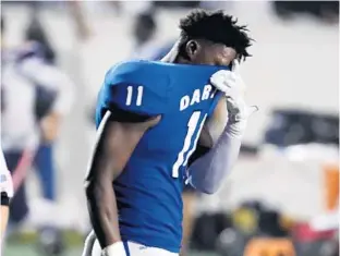  ??  ?? Apopka’s Anthony Fieldings is dejected after losing the Class 8A state high school football championsh­ip game to Miami Columbus Friday night at Daytona Stadium.