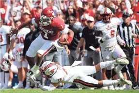  ?? KEVIN JAIRAJ/USA TODAY SPORTS ?? Oklahoma quarterbac­k Jalen Hurts jumps over Texas Tech defensive back Thomas Leggett during the second quarter.