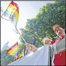  ?? AJC 2014 ?? Rainbow flags line Peachtree Street during last year’s Pride Parade. This year’s parade begins at 1 p.m. today.