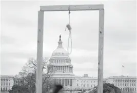  ?? GETTY-AFP ANDREW CABALLERO-REYNOLDS/ ?? A noose is seen on makeshift gallows as supporters of US President Donald Trump gather on the West side of the U.S. Capitol in Washington DC on Jan. 6.