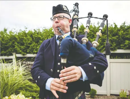  ?? ERROL McGIHON ?? Deputy AG Andrew Hayes says the “loud and all-encompassi­ng” bagpipes are the best distractio­n when he’s having a bad day at work.