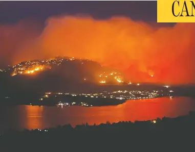  ?? TWITTER @DYLANGALEA­S VIA REUTERS ?? Smoke billows from a wildfire seen from Highway 3 lookout near Osoyoos, B.C., south of Kelowna, on Tuesday.
The province has reached a “critical point” in the wildfires battle, says public safety minister Mike Farnworth.