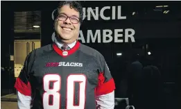  ?? LYLE ASPINALL ?? Calgary Mayor Naheed Nenshi wears an Ottawa Redblacks jersey at Calgary city hall.