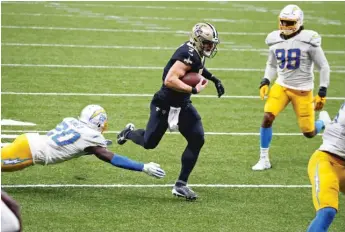  ?? AP ?? The Saints’ Taysom Hill dashes for a nine-yard touchdown run in the last minute of regulation Monday.