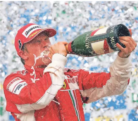  ?? FOTO: GERO BRELOER/DPA ?? Sein größter Erfolg: Kimi Räikkönen feiert am 21.Oktober 2007 in Sao Paulo als Ferrari-pilot den Gewinn des Wm-titels.