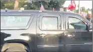  ?? PHILLIP CROWTHER — THE ASSOCIATED PRESS ?? In this image from video, President Donald Trump drives past supporters gathered outside Walter Reed National Military Medical Center in Bethesda, Md., Sunday, Oct. 4. Trump was admitted to the hospital after contractin­g COVID-19.