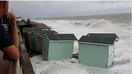  ??  ?? Moving house... beach huts washed away at St Leonards-on-Sea