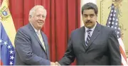 ?? FREDERICO PARRA/AGENCE FRANCE-PRESSE VIA GETTY IMAGES ?? Venezuela's President Nicolas Maduro, right, welcomes State Department envoy Thomas Shannon to Caracas.