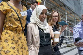  ?? J. SCOTT APPLEWHITE - THE ASSOCIATED PRESS ?? Rep. Ilhan Omar, D-Minn., a target of racist rhetoric from President Donald Trump, walks from the House to her office following votes, at the Capitol in Washington, Thursday.