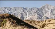  ?? QILAI SHEN/BLOOMBERG ?? Turbines stand at a wind farm in China. Investment in clean energy could lead to a bubble, an analysis of green investing warns.