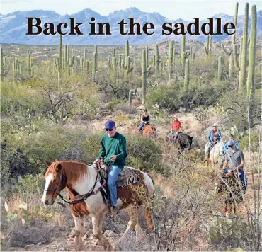  ?? TNS ?? Bill Fink’s dad, George Fink, leads the pack on a family trail ride through the desert at the Tanque Verde Ranch.