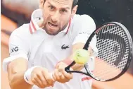  ?? — Gambar AFP ?? TETAP TANGKAS: Aksi Djokovic pada perlawanan Terbuka Itali menentang Fritz di Rome, Itali.