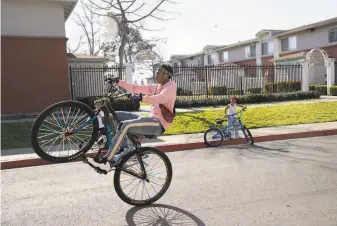  ?? Paul Kuroda / Special to The Chronicle ?? The neighborho­od near the Oakland Coliseum is in one of the lowerincom­e ZIP codes that the state is prioritizi­ng for distributi­ng 40% of its COVID19 vaccine doses starting next week.