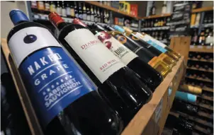  ?? CP PHOTO ?? Bottles of B.C. wine on display at a liquor store in Cremona, Alta., on Feb. 7. The B.C. government has launched a formal challenge against Alberta’s ban on its wines.