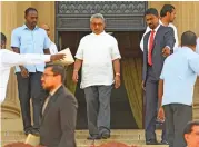  ?? (AFP) ?? President Gotabaya Rajapaksa (centre) arrives for a group photograph after the ministeria­l swearing-in ceremony, in Colombo on Friday