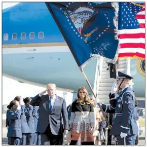  ?? AP/ANDREW HARNIK ?? President Donald Trump salutes the troops as he and his wife, Melania, arrive today at Yokota Air Base on the outskirts of Tokyo at the start of his trip across Asia.