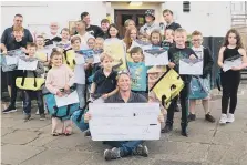  ?? ?? The Scarboroug­h Yacht Club young sailors receive their certificat­es