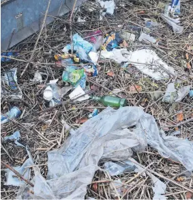  ?? ?? ● The litter-blighted slip roads at junction 12 of the M56 motorway in Runcorn.