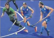  ?? AFP ?? ▪ Akashdeep Singh (C) and Sardar Singh (R) in action on Monday.