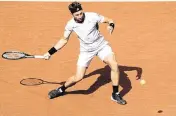  ?? PRESSINPHO­TO USA TODAY NETWORK ?? Casper Ruud hits a return against Stefanos Tsitsipas at Real Club de Tenis Barcelona on Sunday in Barcelona Spain.