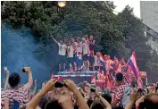  ?? AP ?? It may have lost the final, but the Croatian team was enthusiast­ically embraced by supporters as the players were driven through central Zagreb.