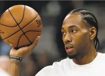  ?? Eric Gay / Associated Press ?? Spurs forward Kawhi Leonard reportedly is at odds with San Antonio’s coach, medical staff and some of his teammates. He likes Southern California — will he go to the Lakers?