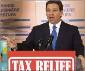  ?? DOUG ENGLE — OCALA STAR-BANNER VIA AP ?? Florida Gov. Ron DeSantis speaks during a news conference at MVP Appliances in Ocala on Wednesday. DeSantis mentioned Disney and how it will be no longer be self governing “because there’s a new sheriff in town.”