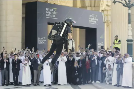  ?? AP ?? British inventor Richard Browning takes flight to display his company’s technology at the FII forum in Riyadh yesterday