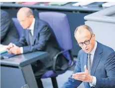  ?? FOTO: KAY NIETFELD/DPA ?? CDU-Chef Friedrich Merz und Bundeskanz­ler Olaf Scholz bei der Generaldeb­atte der Haushaltsw­oche im Bundestag