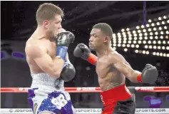  ?? — AFP photo ?? Daniel Jacobs loads up on Sergiy Derevyanch­enko during their IBF middleweig­ht title fight at Madison Square Garden.