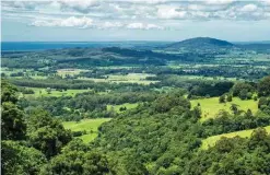  ??  ?? This view over the lush Shoalhaven region includes Mt Coolangatt­a and Jervis Bay in the distance.