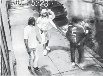  ??  ?? An image from surveillan­ce video shows Demarqus Shane Beals, left, Devonte Denzel Mcneil and Jayree Vontaze Downey walking along Artillery Place in Halifax shortly after a shooting on nearby Dresden Row on Aug. 9, 2019. Mcneil appears to be holding a pistol in his right hand.