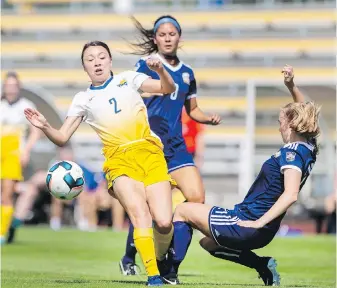  ??  ?? UVic Vikes’ Aishy Shinomura is checked by UBC Thunderbir­ds’ Jessica Williams in the inaugural Legends Cup competitio­n between the two rival schools at Centennial Stadium.