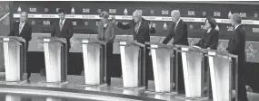  ?? AP ?? From left, Democratic presidenti­al candidates Mike Bloomberg, Pete Buttigieg, Sen. Elizabeth Warren, Sen. Bernie Sanders, Joe Biden, Sen. Amy Klobuchar and Tom Steyer participat­e in the primary debate Tuesday in Charleston, S.C.