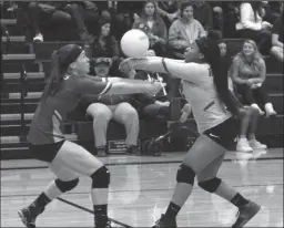  ?? MIKE BUSH/ NEWS-SENTINEL ?? Liberty Ranch libero Keauna Cason (right) gets to the volleyball before teammate Kayden Freeman in the first set of Monday's Sac-Joaquin Section Division III playoff playin match against Mountain House at The Hawks Nest.