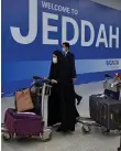  ?? AFP ?? Passengers at King Abdulaziz Internatio­nal Airport in the coastal city of Jeddah