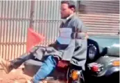  ??  ?? The youth tied to the jeep has been identified as Farooq Ahmed Dar, a resident of Chhil Brass of Budgam.